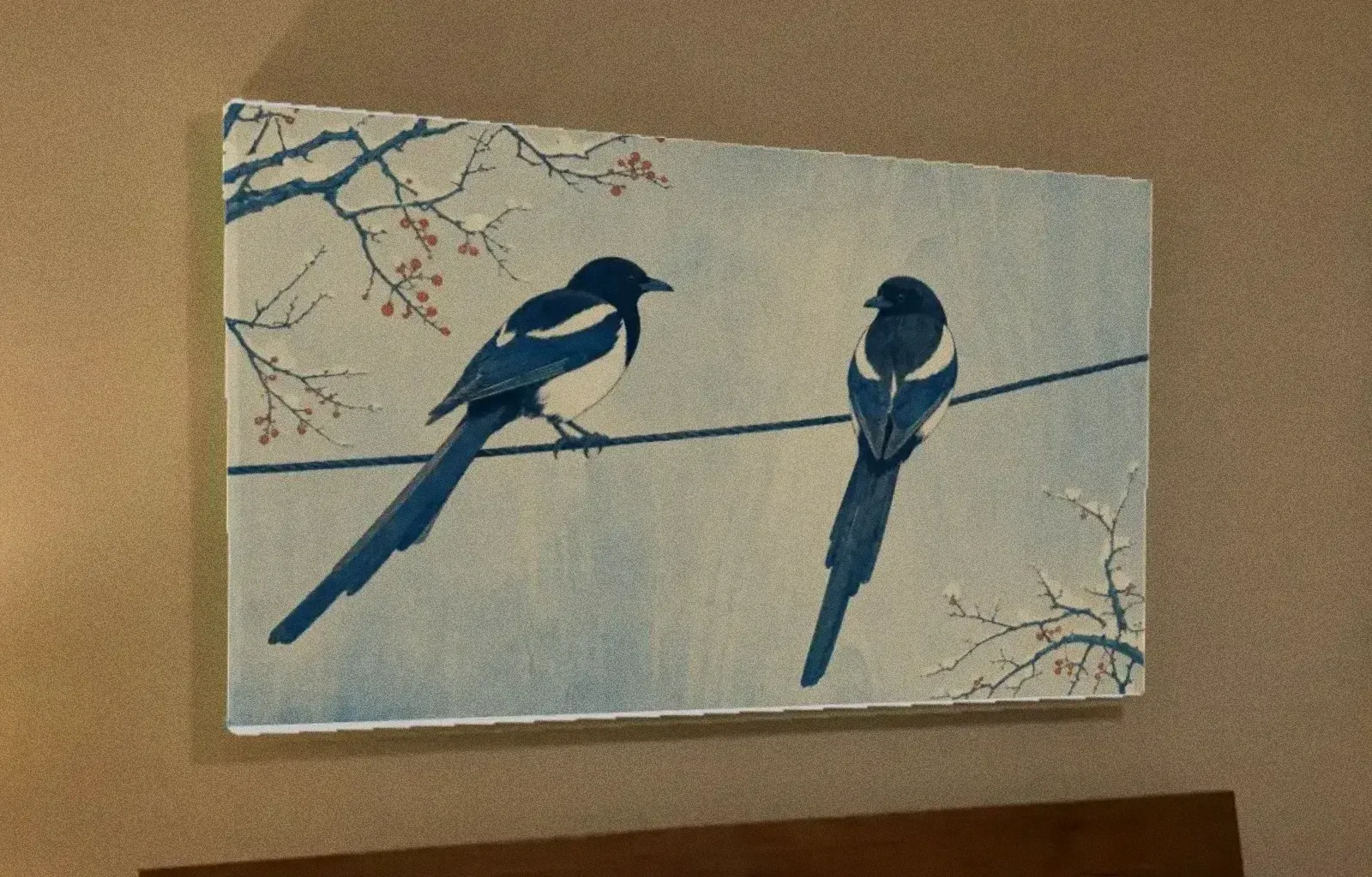 The same painting as a 36 by 24 inch canvas above Priya’s bed